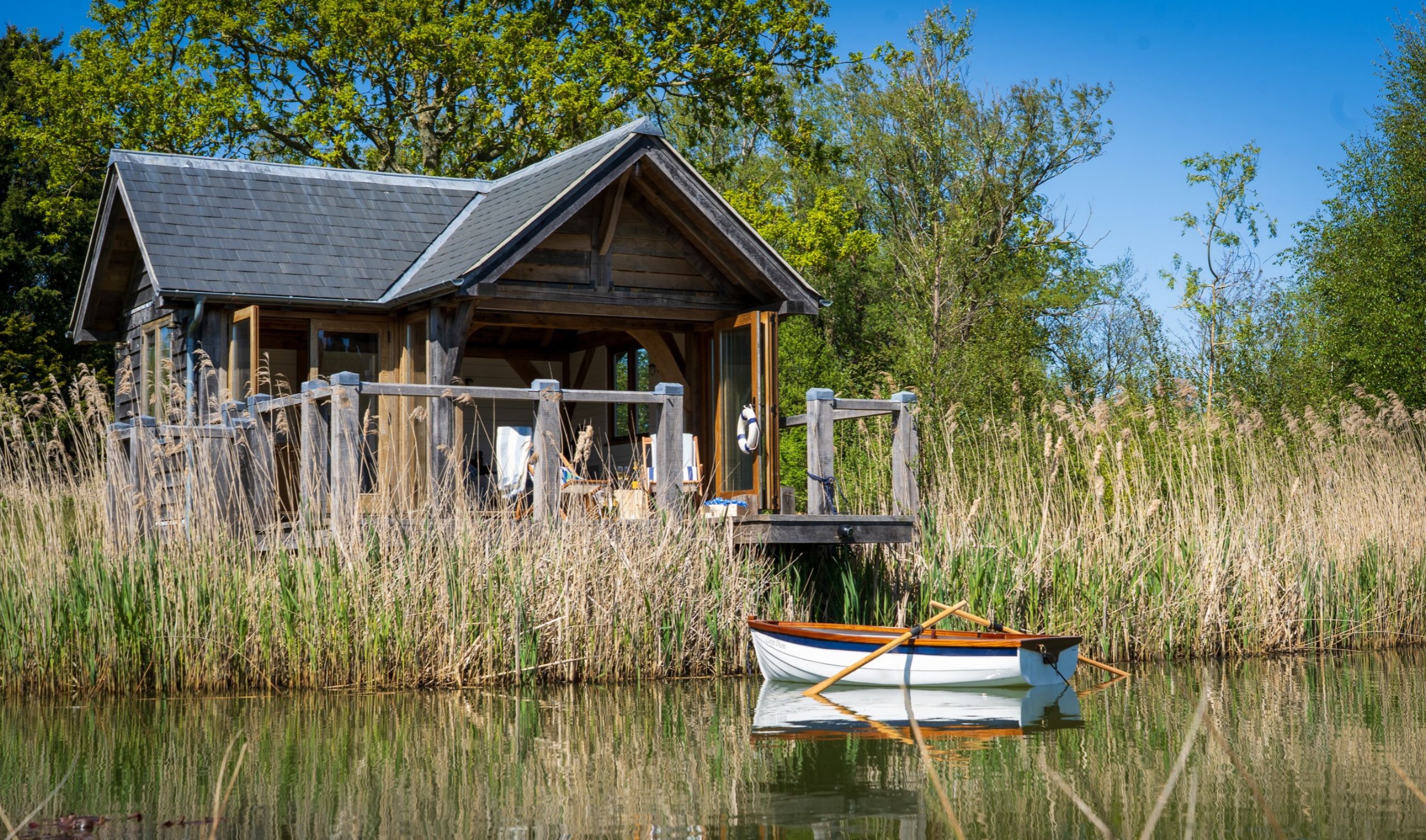 oak framed boathouse in the Isle of Wight set on a beautiful lake